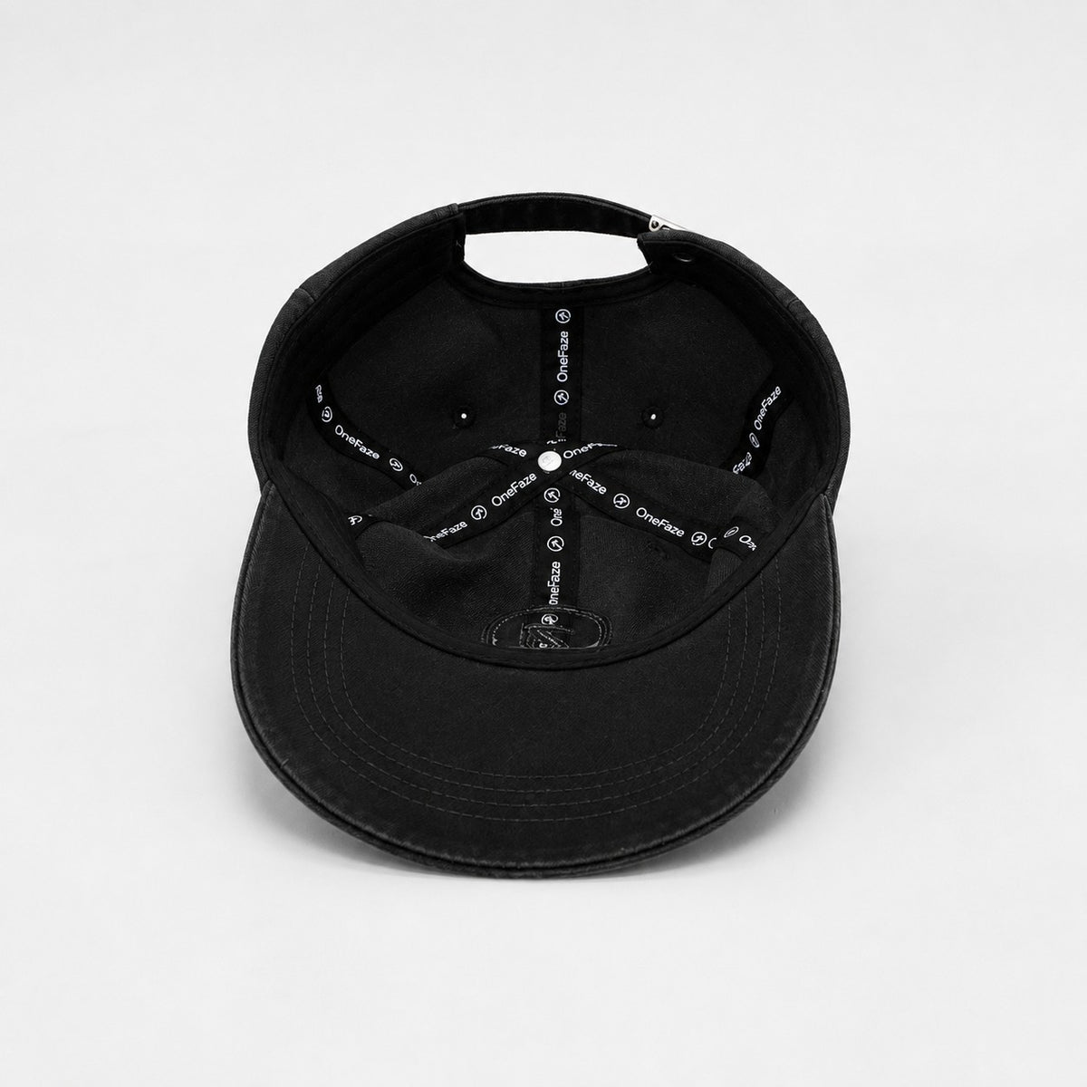 Inside — OneFaze woven taping and cotton sweatband inside the Charcoal Black cap