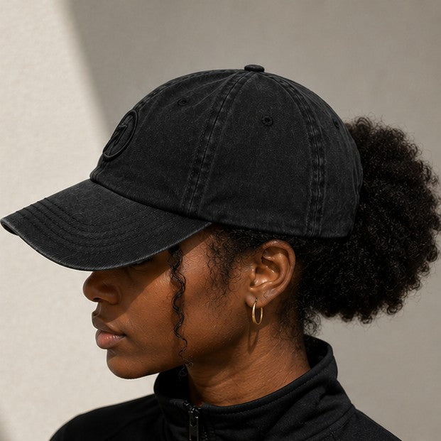 Side — Charcoal Black Heritage Washed Cap worn, showing pre-curved brim and washed cotton