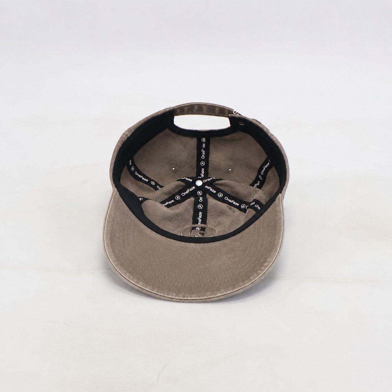 OneFaze Heritage Washed Cap Taupe — detail view of the branded inside lining